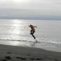 Jenny skipping in the ocean.